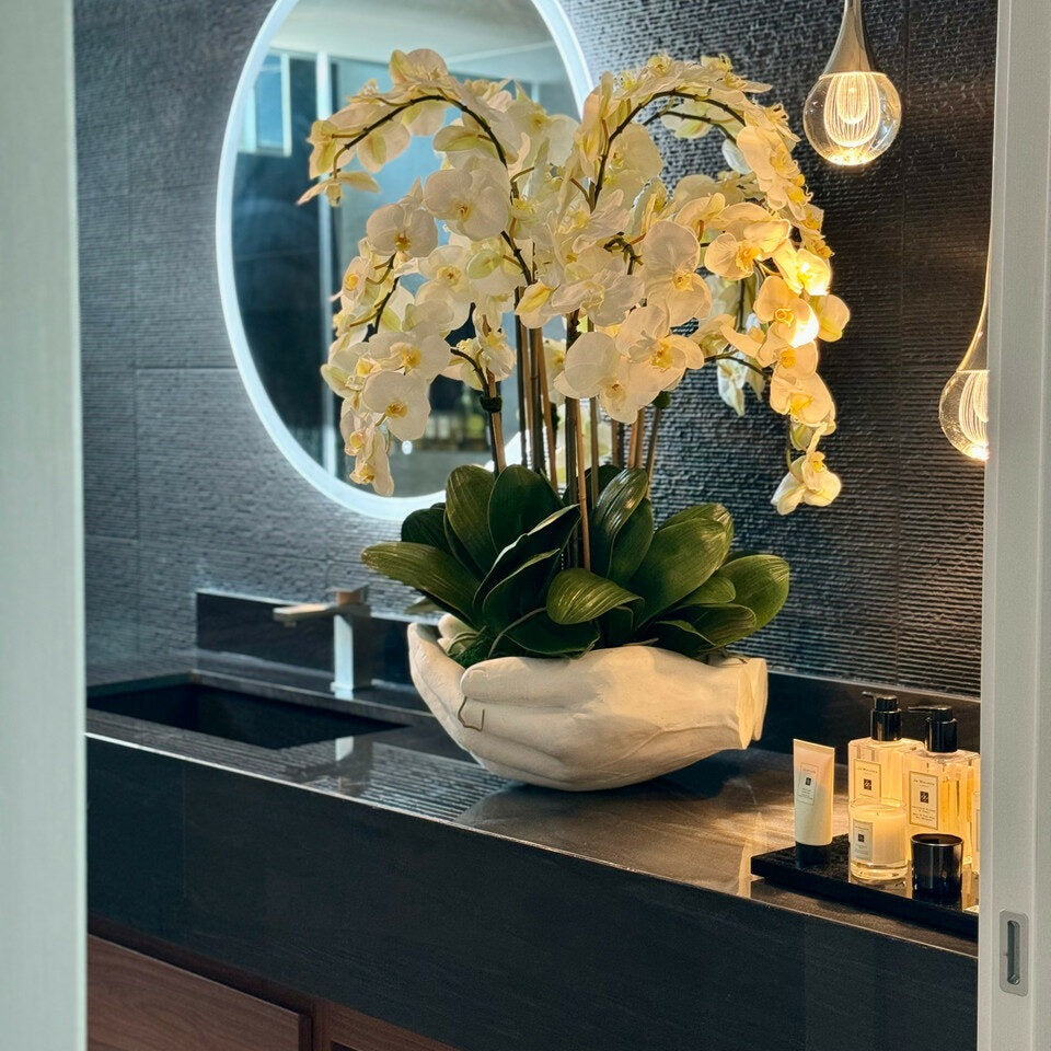 White Phalaenopsis Orchids in Open Hands Sculpture Pot